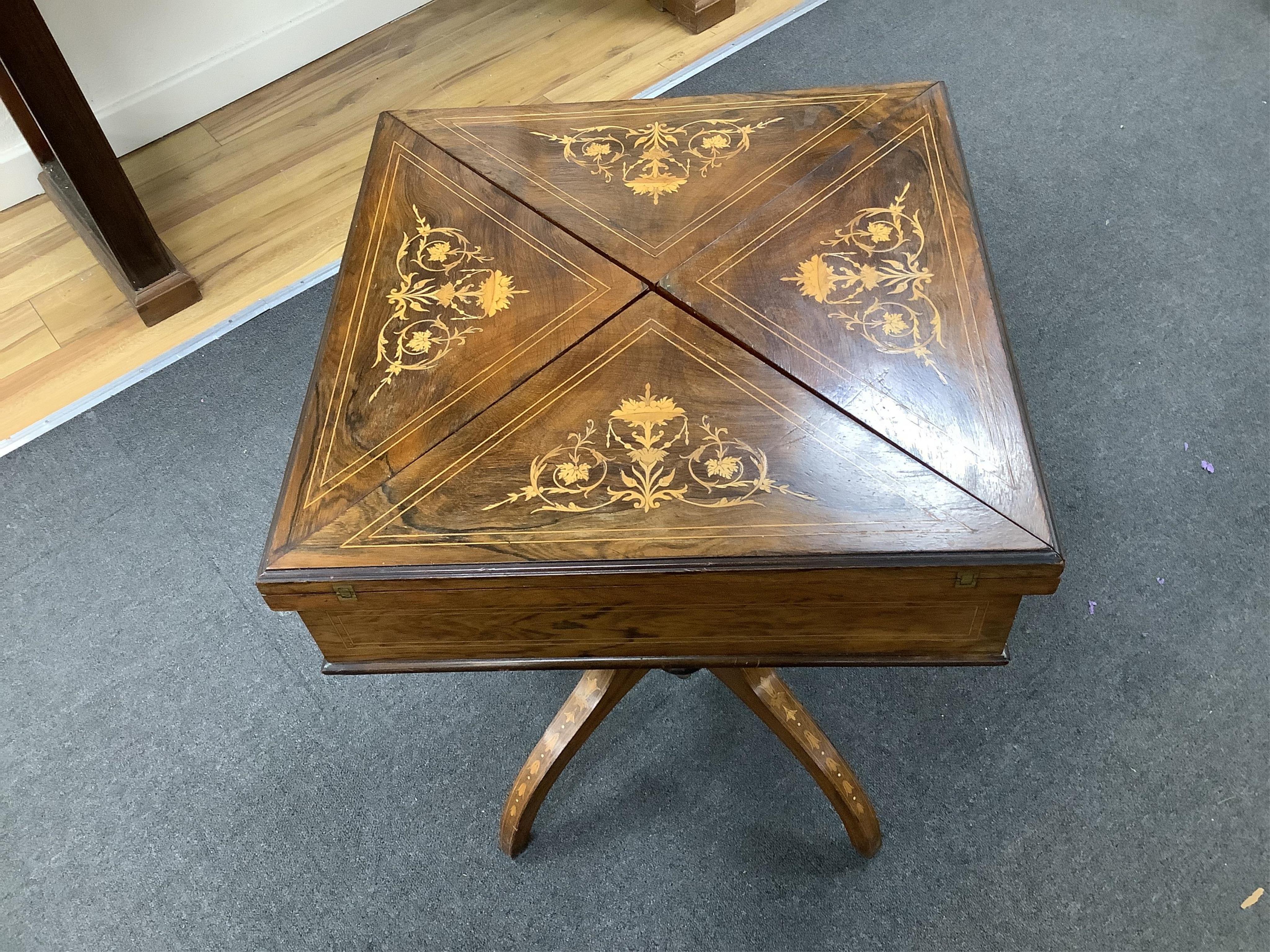 A late Victorian inlaid rosewood envelope card table, width 55cm, depth 55cm, height 71cm. Condition - fair